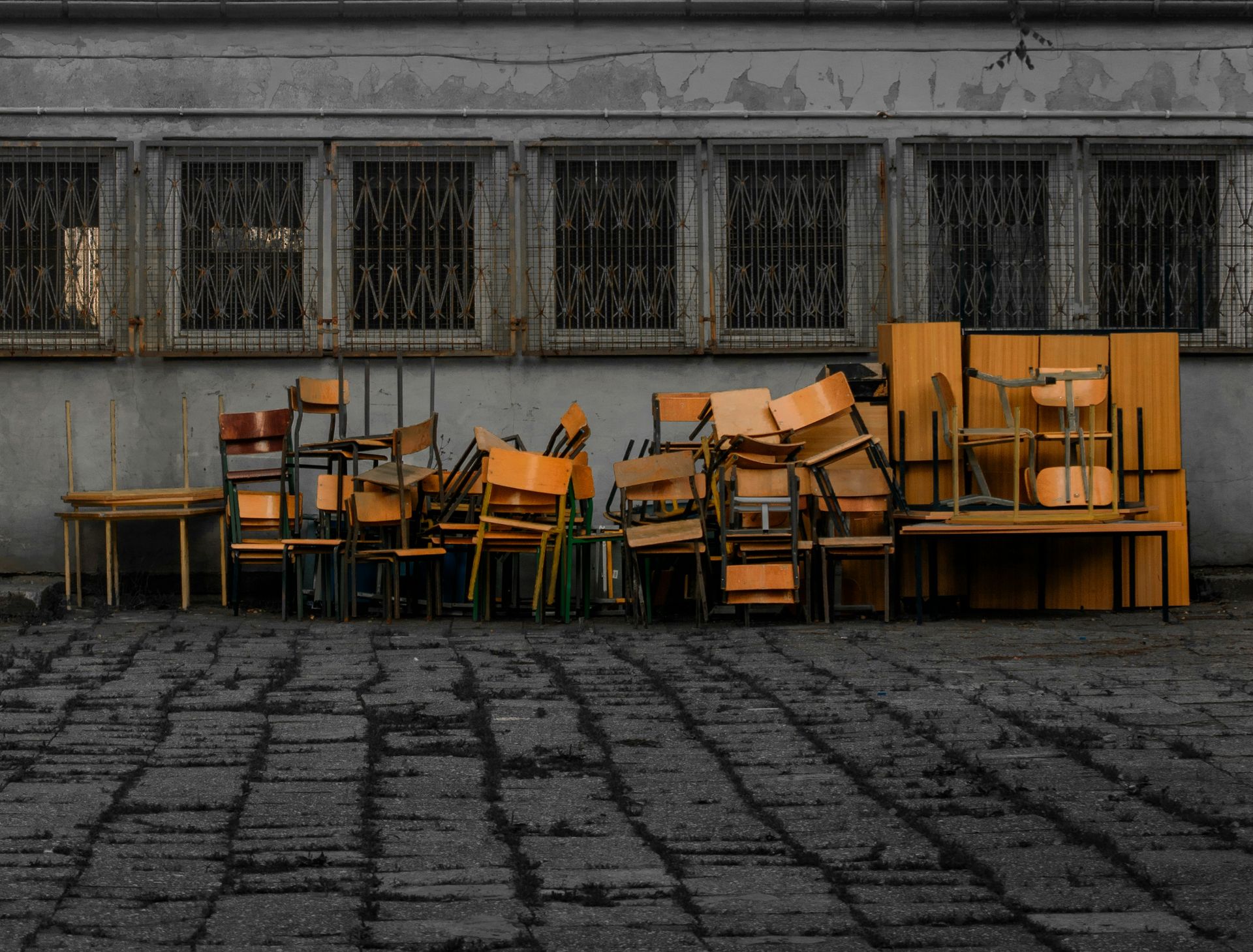 a group of tables and chairs outside a building